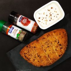A picture of Garlic Bread with fresh basil (no oven bread).