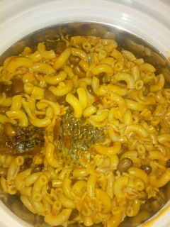 A picture of Macaroni jolluf with beans and fish.