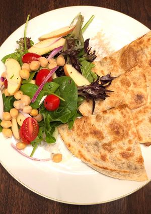 A picture of Chickpeas Lemon Peppers Salad with Refried Bean Veggies Quesadilla.