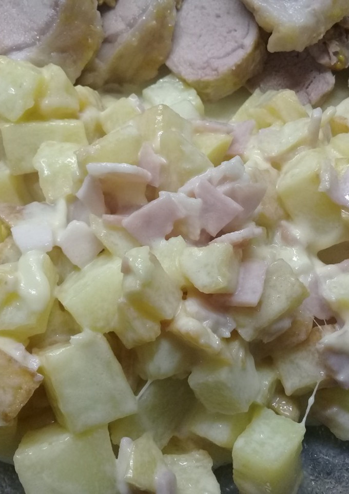Una foto de Papas con crema y panceta