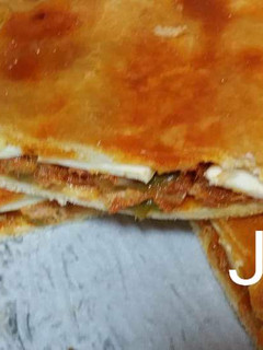 Una foto de Empanada de atún con pisto