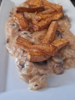 Una foto de Crema de champiñones con tofu salteado