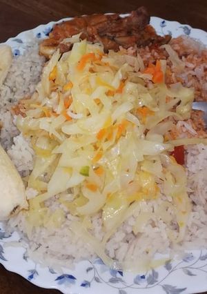 A picture of Rice and chicken stew with steamed cabbage.
