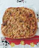 Pizza de pavo, cebolla caramelizada y miel. Base casera integral
