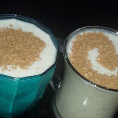A picture of Banana milkshake with coconut cinnamon.