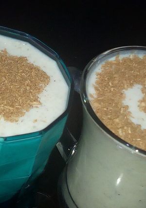 A picture of Banana milkshake with coconut cinnamon.