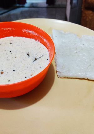 A picture of Coconut Chutney with Neer Dosa.