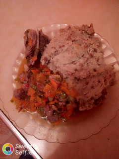 A picture of Pigeon pea mukimo and beef stew.