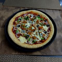 A picture of Chicken Tikka Pan Pizza 🍕.