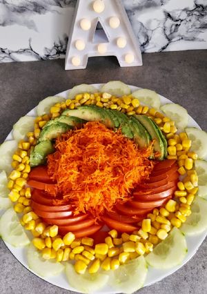 Une photo de Carotte râpé et salade composée