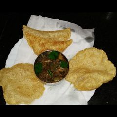 A picture of Stuffed egg burji poori.