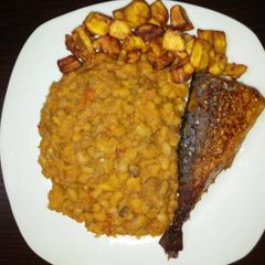 Porriage beans with fried plantain and fish A picture of Porriage beans with fried plantain and fish.
