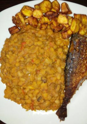 A picture of Porriage beans with fried plantain and fish.