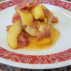 A picture of Candied bacon and apples over biscuits.