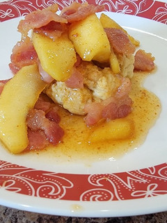 A picture of Candied bacon and apples over biscuits.