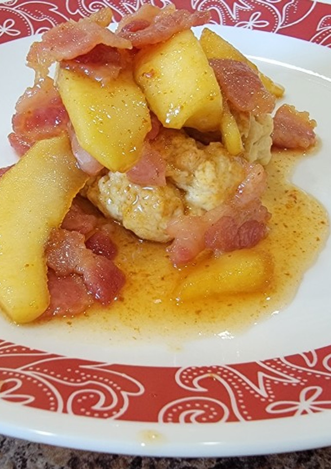 A picture of Candied bacon and apples over biscuits.