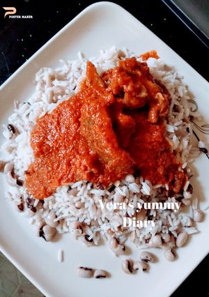 A picture of Rice/Beans and palm oil stew.