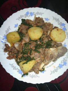 A picture of Beef served with potatoes.
