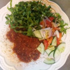 A picture of White rice with stew.