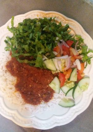 A picture of White rice with stew.