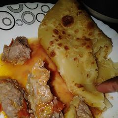 Chapati with beef stew A picture of Chapati with beef stew.