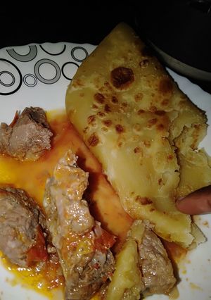 A picture of Chapati with beef stew.
