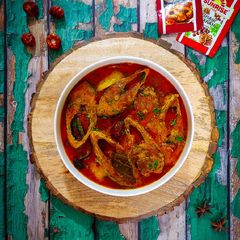 A picture of Iilish er Jhol (Hilsa curry).