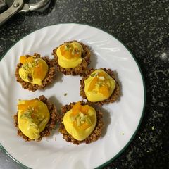 A picture of Mango shrikhand granola tarts.