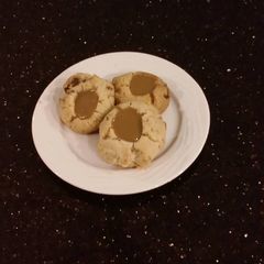 A picture of Toffee Shortbread Cookies With a Creamy Coffee Ganache Center.