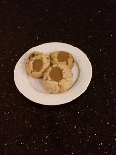 A picture of Toffee Shortbread Cookies With a Creamy Coffee Ganache Center.