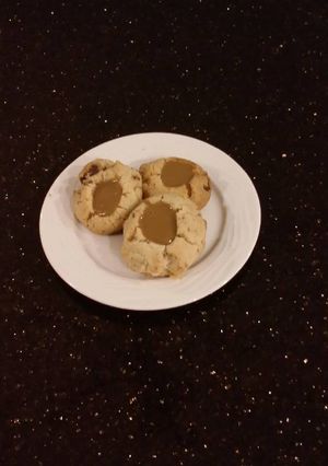 A picture of Toffee Shortbread Cookies With a Creamy Coffee Ganache Center.