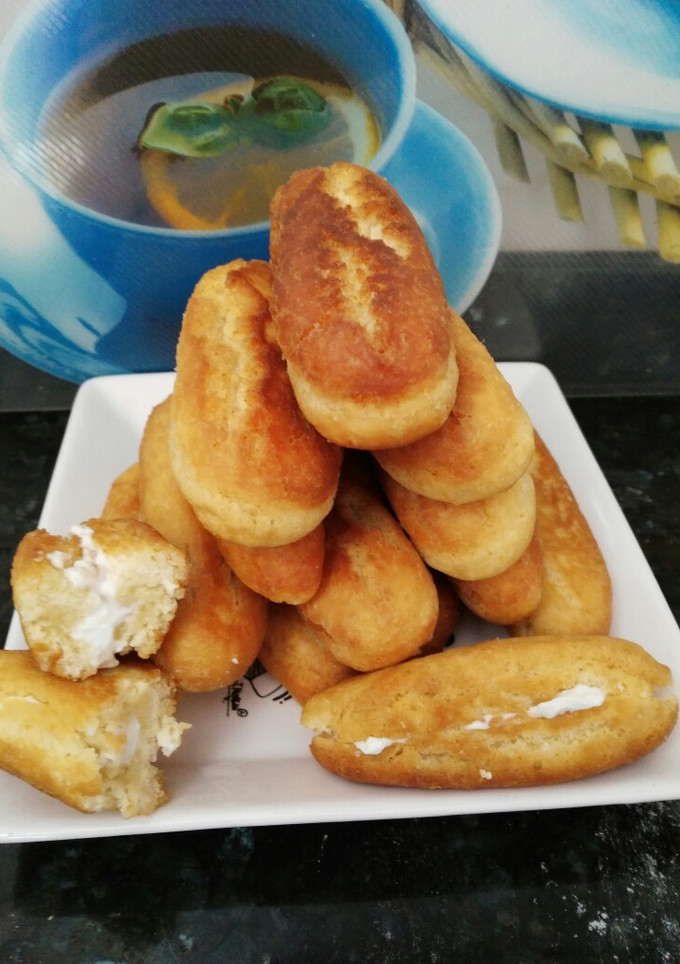 Una foto de Palos de leche condensada relleno de crema de queso