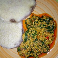 A picture of Boiled yam and Egusi soup.