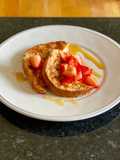 Eggy bread with strawberries and maple syrup