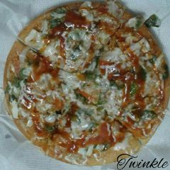 A picture of Home made tawa pizza.