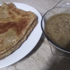 A picture of Square paratha with daal.