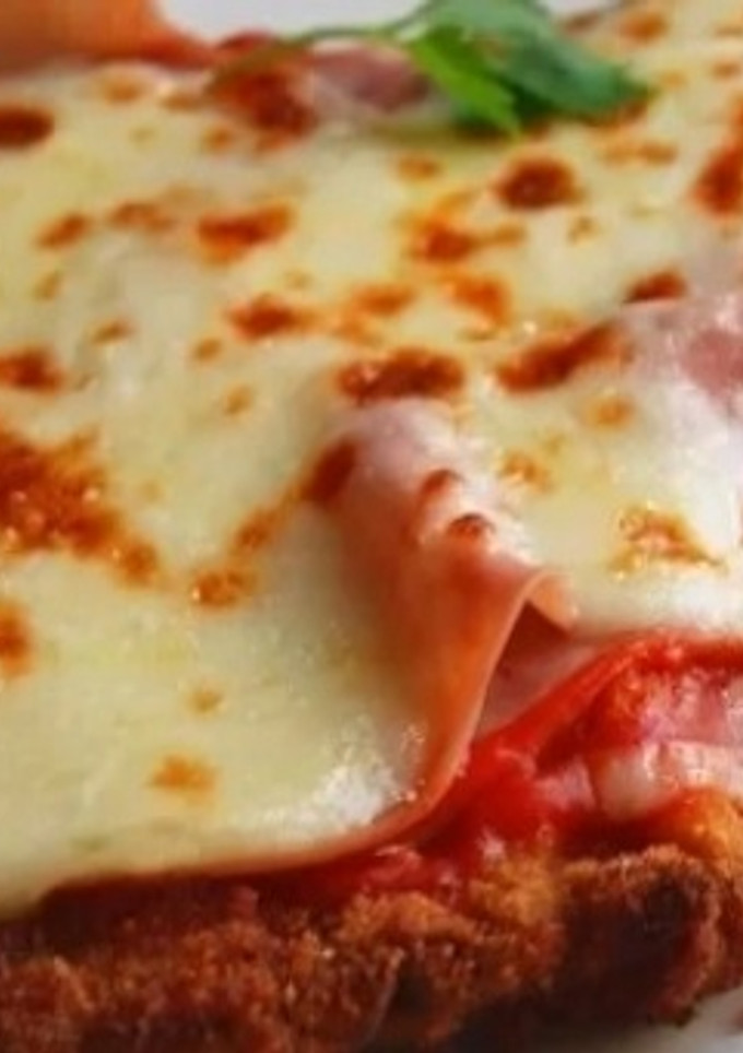 Una foto de Milanesa napolitana