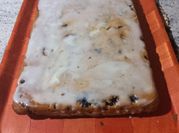 Una foto de kuchen de crema y fruta
