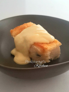 A picture of Bread & Butter Pudding with Vanilla Custard Sauce.