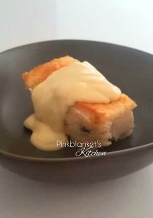 A picture of Bread & Butter Pudding with Vanilla Custard Sauce.