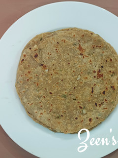 A picture of Bajra and Wheat Chapatis with Spring Onions.