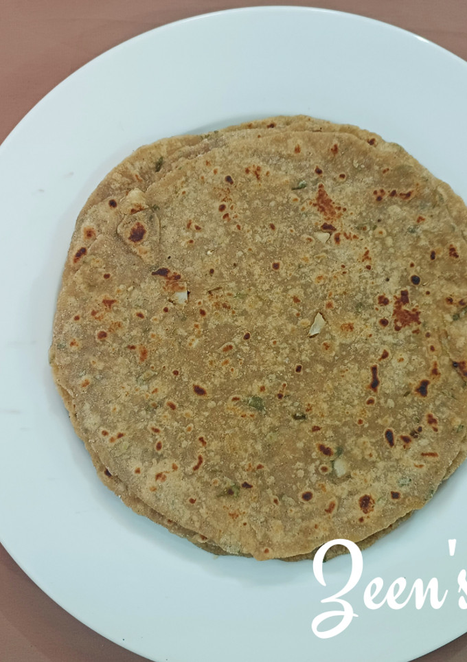 A picture of Bajra and Wheat Chapatis with Spring Onions.