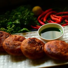 A picture of Deep Fried Kachoris Stuffed With Spicy Gram Flour Mixture.