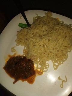 A picture of Indomie with yummy sauce.