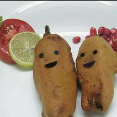 A picture of Stuffed chilli with cheesy chicken.