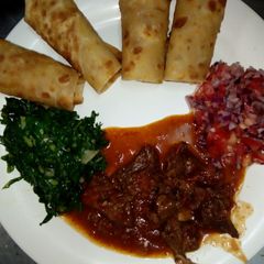 A picture of Chapati with fried kales.