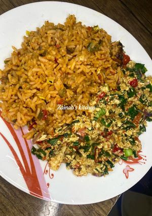 A picture of Palm oil jollof 🍚 rice 🍽.