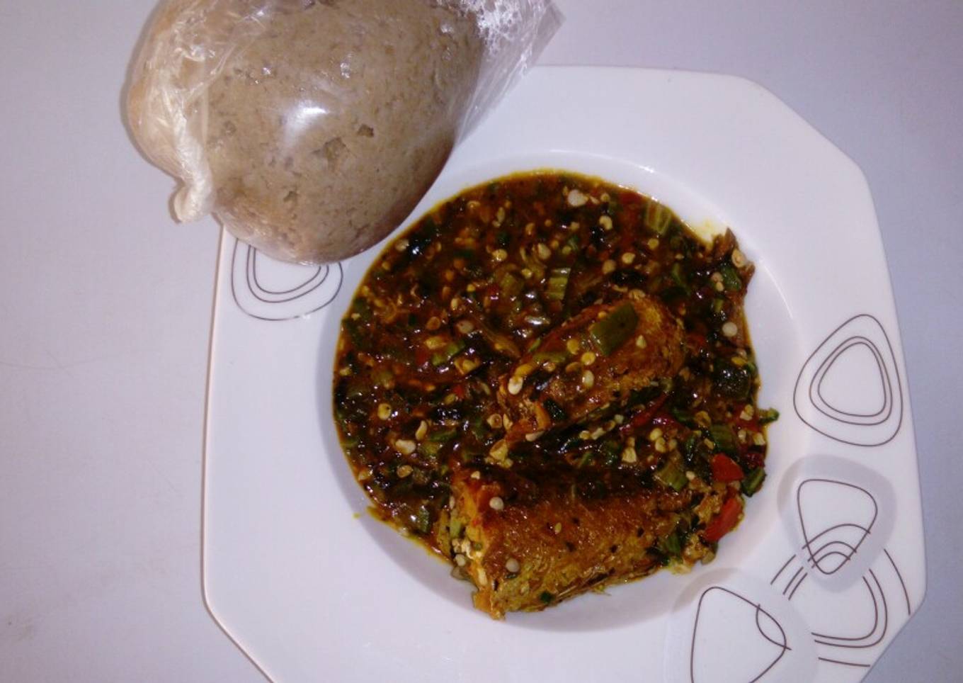 Wheat swallow with fresh okro and croker fish soup