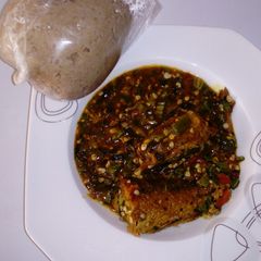 A picture of Wheat swallow with fresh okro and croker fish soup.