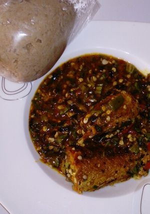 A picture of Wheat swallow with fresh okro and croker fish soup.